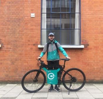 Deliveroo rider with electric bike 